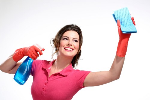 Specialist upholstery cleaning equipment in use on a sofa